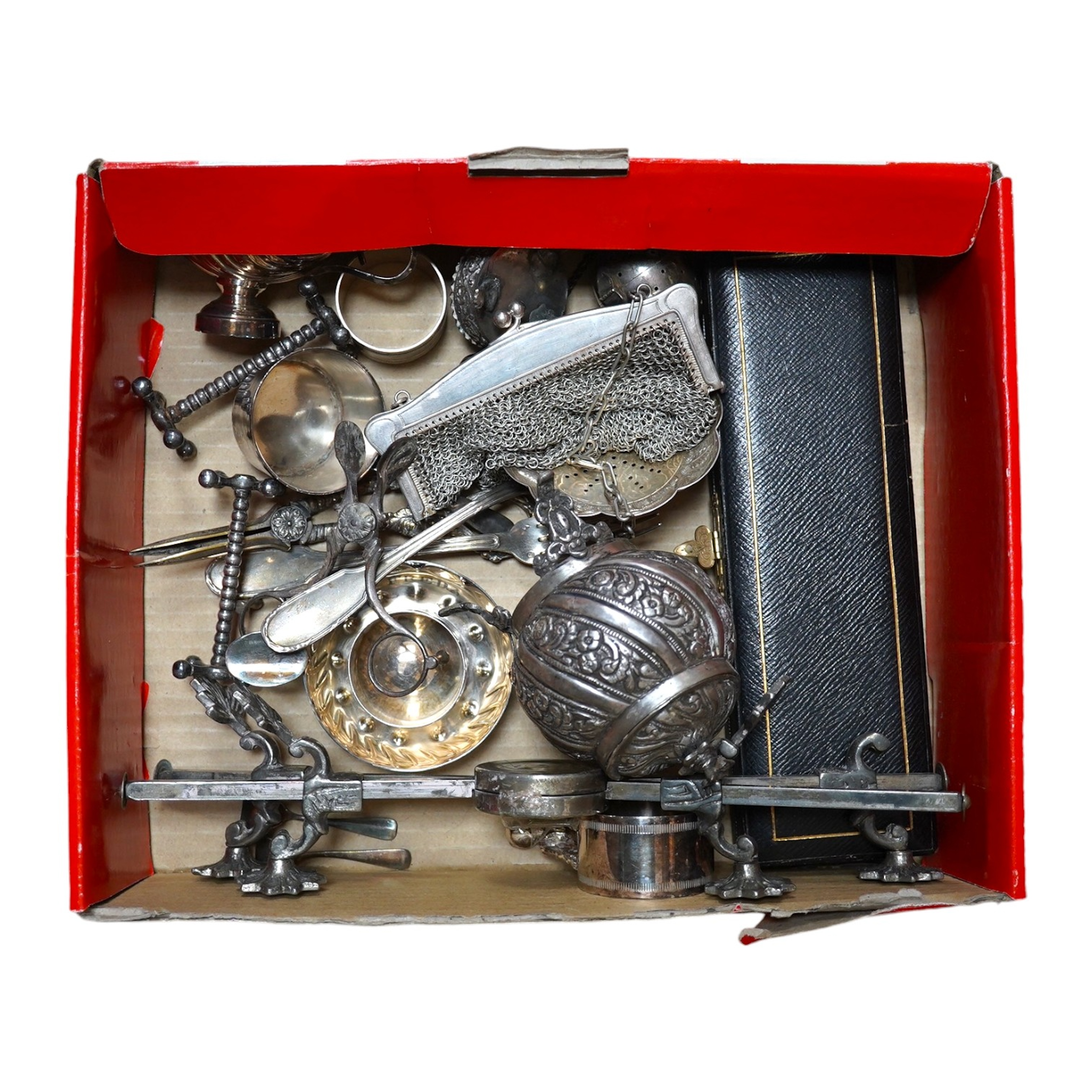 A group of mostly plated wares including a dish stand and grape shears, a white metal box and cover, a Niello decorated white metal napkin ring, a Dutch fork and spoon, and a mesh purse. Condition - fair.